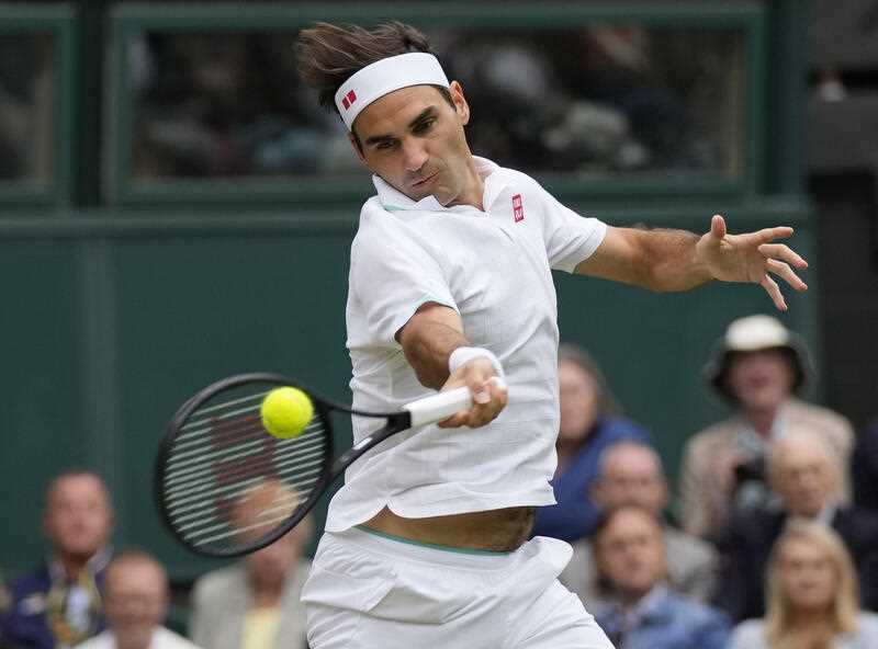 Male tennis champion Roger Federer in action on court