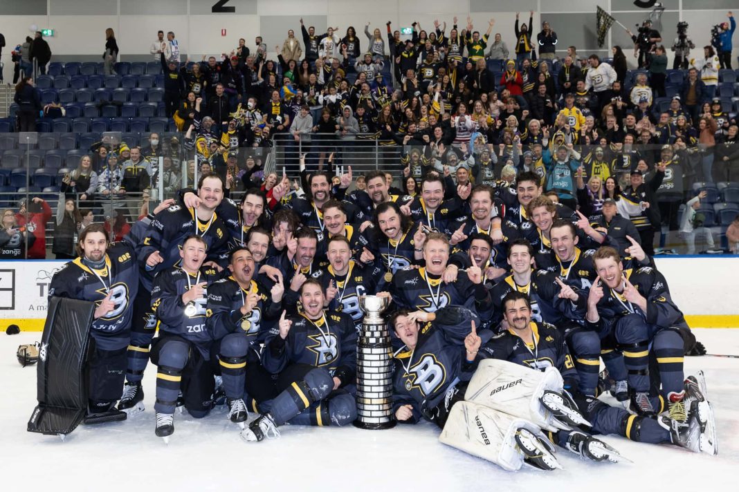 winning Australian Ice Hockey League team CBR Brave celebrating with their trophy