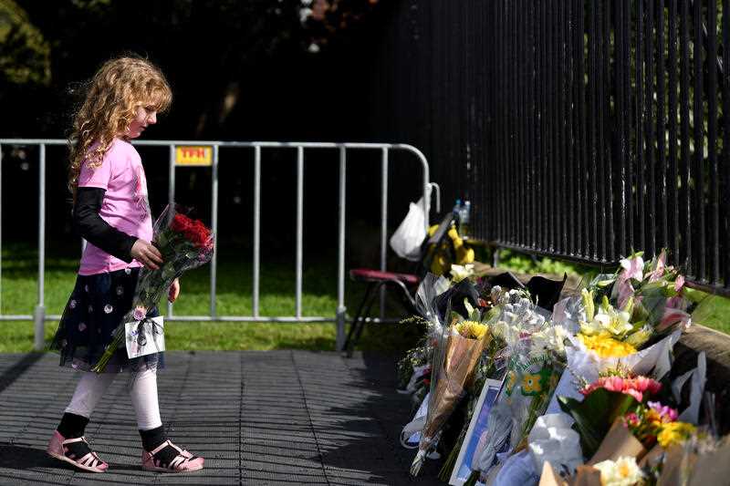 Members of the public leave messages of condolences and floral tributes to Queen Elizabeth II are left at the gates of Government House Sydney, in Sydney, Saturday, September 10, 2022