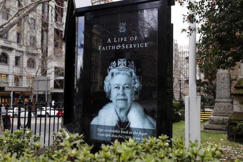 A portrait of Queen Elizabeth II is seen on an electronic noticeboard in Melbourn
