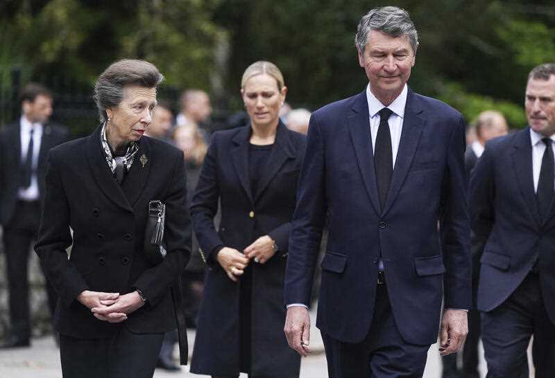 Princess Anne, the Princess Royal, Zara Tindall, Vice Admiral Timothy Laurence and Peter Phillips walk with other members of the family to thank well-wishers, following the death of Queen Elizabeth II, outside the gates of Balmoral Castle