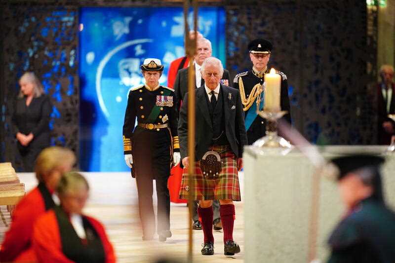 King Charles III, center, Princess Anne, left, Prince Andrew and Prince Edward, right, hold a vigil at the coffin of Queen Elizabeth II at St Giles' Cathedral, Edinburgh, Scotland, Monday Sept. 12, 2022