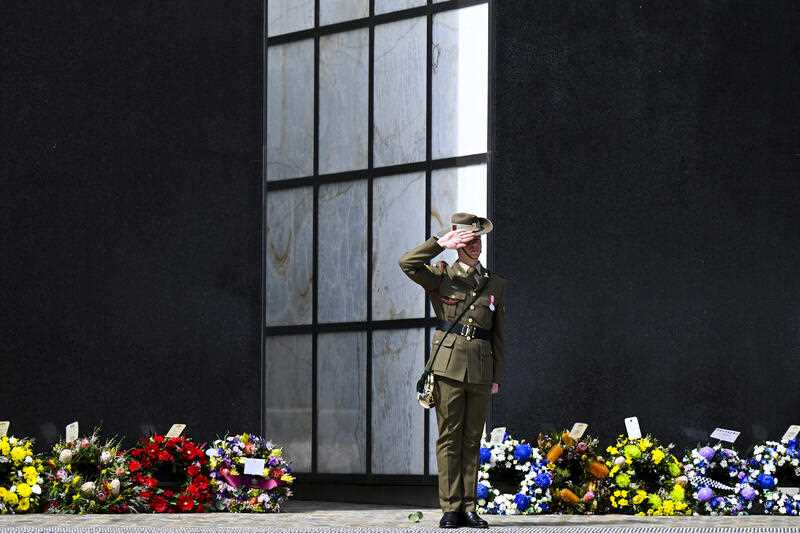 A member of the Catafalque Party is seen after playing the last post during a commemorative service recognising the 75th anniversary of Australia’s involvement in peacekeeping efforts around the world, Australian War Memorial, Canberra, Wednesday, September 14, 2022