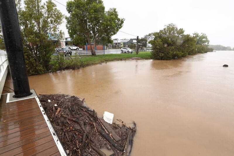 Debris floating in a flooded river in NSW