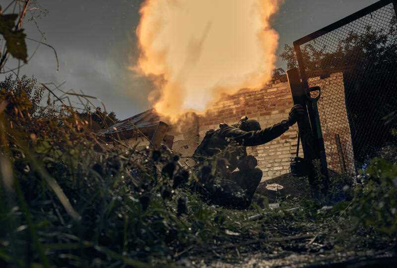 Ukrainian soldiers fire in the recently retaken Kupiansk in the Kharkiv region, Ukraine, Friday, Sept. 23, 2022