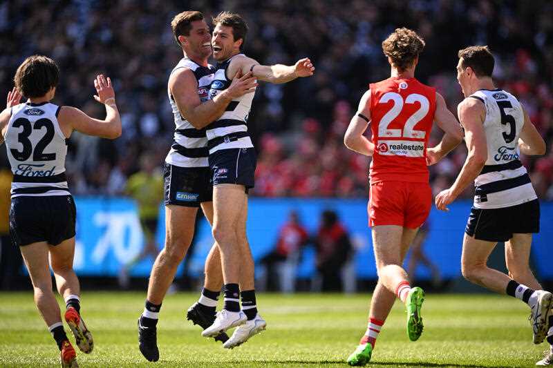 Tom Hawkins of the Cats celebrates with Jeremy Cameron of the Cats after scoring a goal during the AFL Grand Final match between the Geelong Cats and the Sydney Swans at the Melbourne Cricket Ground on Saturday 24 September 2022