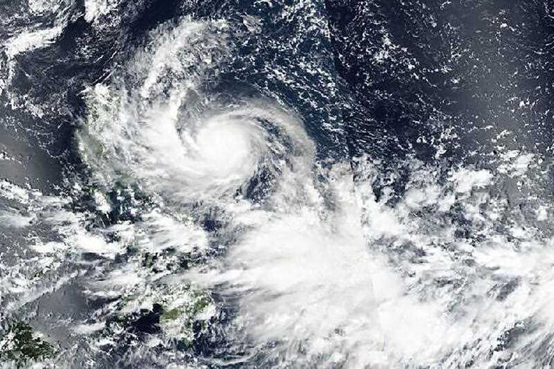 satellite image released by NASA shows Typhoon Noru approaching Philippines