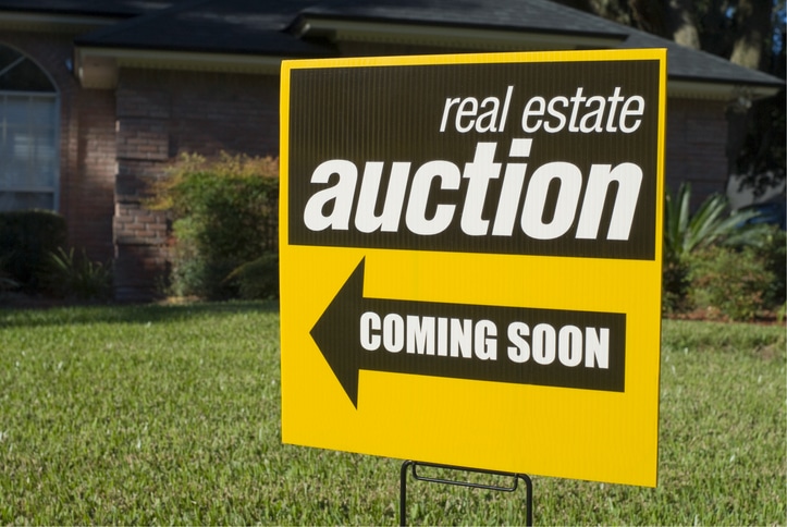 Real Estate Auction sign in a front yard
