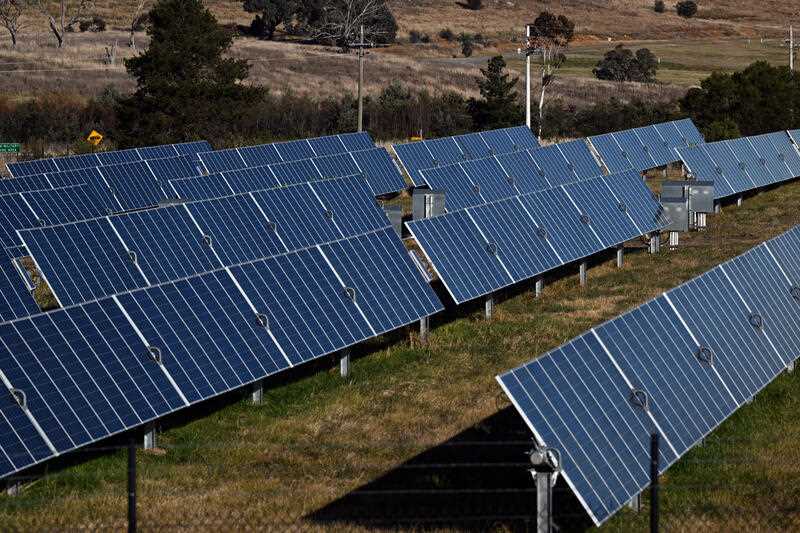 Solar panels are seen at solar farm on the northern outskirts of Canberra