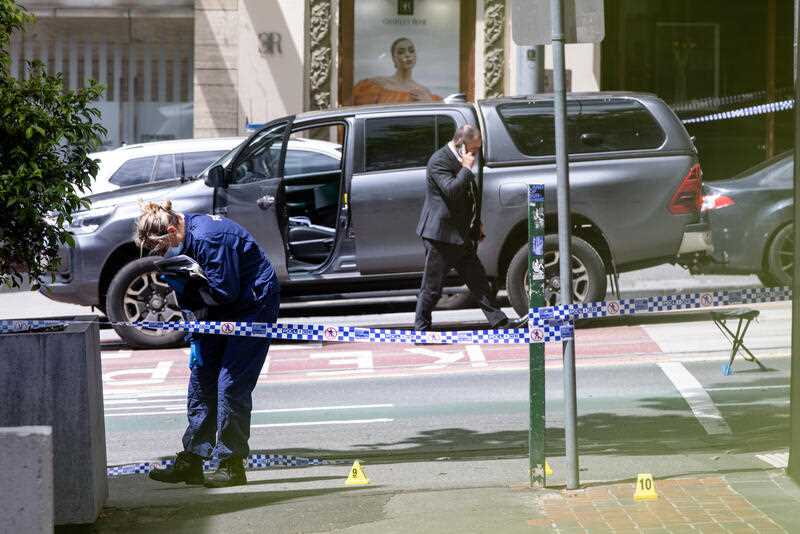 Homicide Squad detectives at a crime scene in Melbourne CBD, Sunday, October 30, 2022