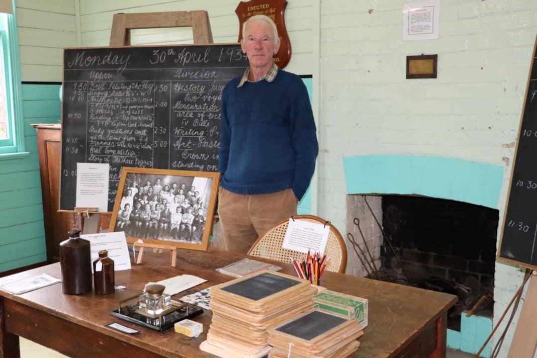 elderly man in old bush school museum