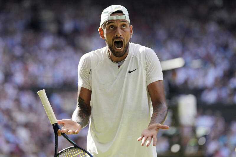Australia's Nick Kyrgios reacts as he plays Serbia's Novak Djokovic in the final of the men's singles on day fourteen of the Wimbledon tennis championships in London, Sunday, July 10, 2022