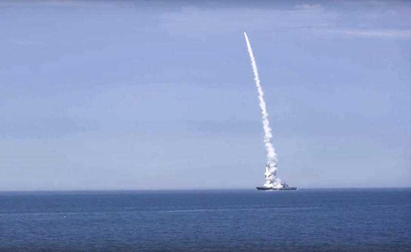 in this handout photo released by Russian Defense Ministry Press Service on Monday, Oct. 10, 2022, a Russian warship launches a cruise missile at a target in Ukraine.