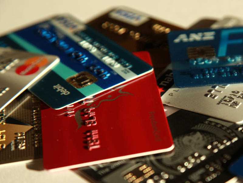 a selection of credit cards are scattered on a tabletop