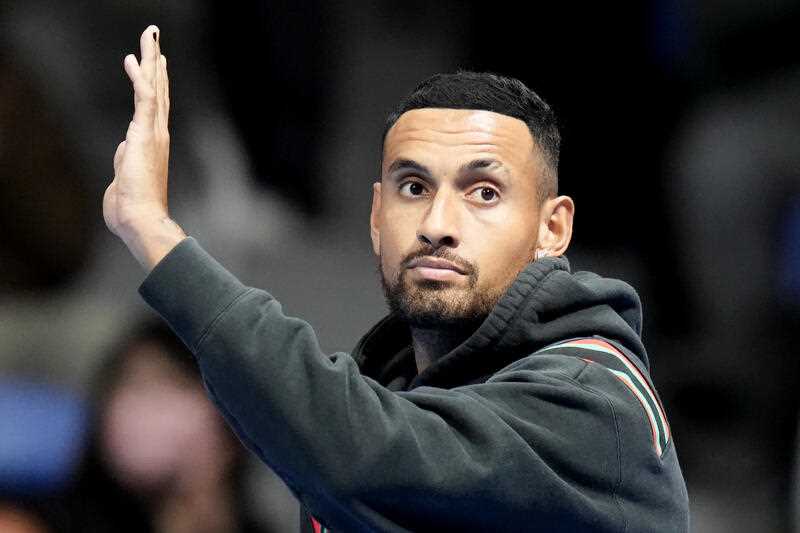 Nick Kyrgios of Australia waves as he withdrew from his singles match against Taylor Fritz of the U.S. at the Rakuten Open tennis championships at Ariake Colosseum Friday, Oct. 7, 2022, in Tokyo