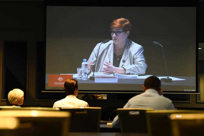 Senator Marise Payne is seen on a screen in the media room at the first hearing block of the Royal Commission into the Robodebt Scheme at the Pullman Brisbane King George Square Hotel in Brisbane, Tuesday, December 13, 2022.