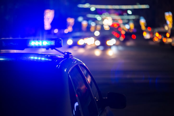 police car lights at night in city with selective focus