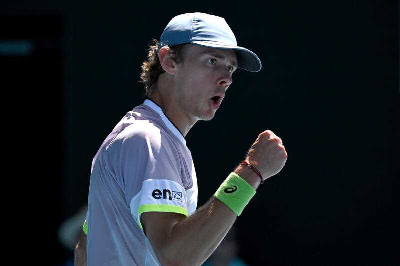 Australian tennis player Alex de Minaur reacts after winning a point at the Australian Open