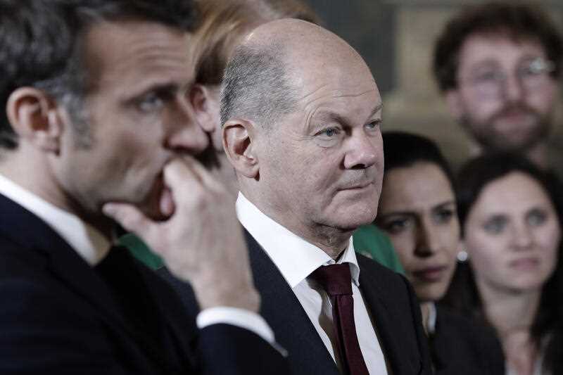 German Chancellor Olaf Scholz, center, and French President Emmanuel Macron listen to Young Talents of Generation Europe Sunday, Jan. 22, 2023 at the Elysee Palace in Paris