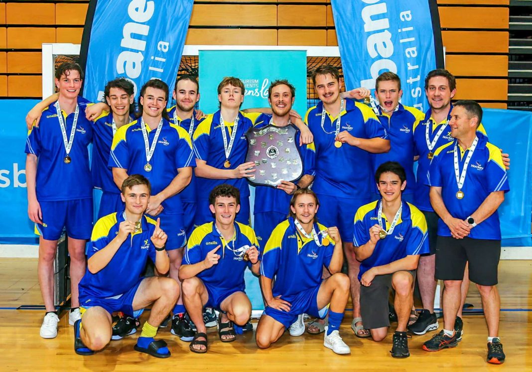 ACT Hockey men's under 21 team in blue and yellow uniforms celebrating national championship win