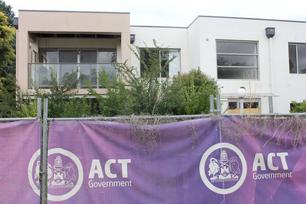 temporary fencing surrounding vacant public housing units in inner north Canberra
