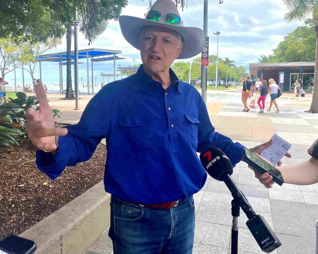 male politician in big hat standing on the Cairns esplanade