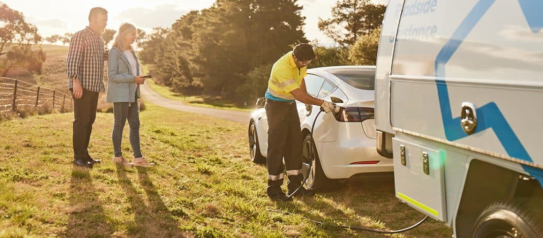 NRMA patrol providing emergency charging for electric car pulled up beside a country road