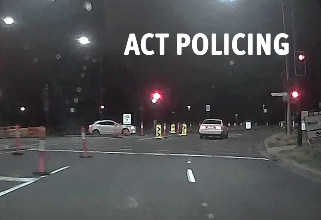 white car seen running a red light in Canberra city in the early hours of Friday morning 27 January 2023