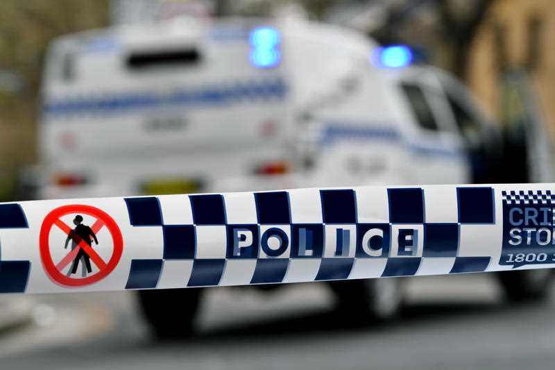 Police tape restricts access to a street in Sydney