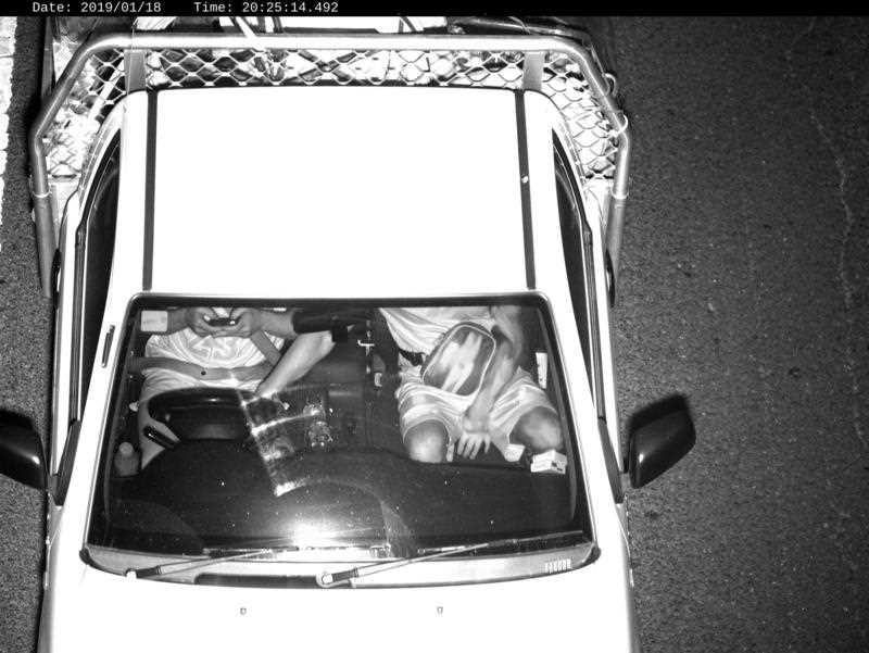 photo captured by a Mobile Phone Detection Camera and released by Transport for NSW shows a driver using a mobile phone while driving