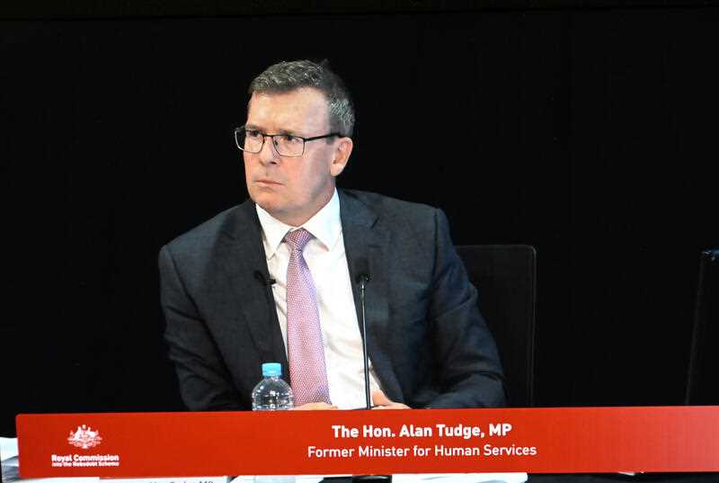 Former Liberal minister Alan Tudge is seen on a screen in the media room during the third block of public hearings of the Royal Commission into the Robodebt Scheme in Brisbane