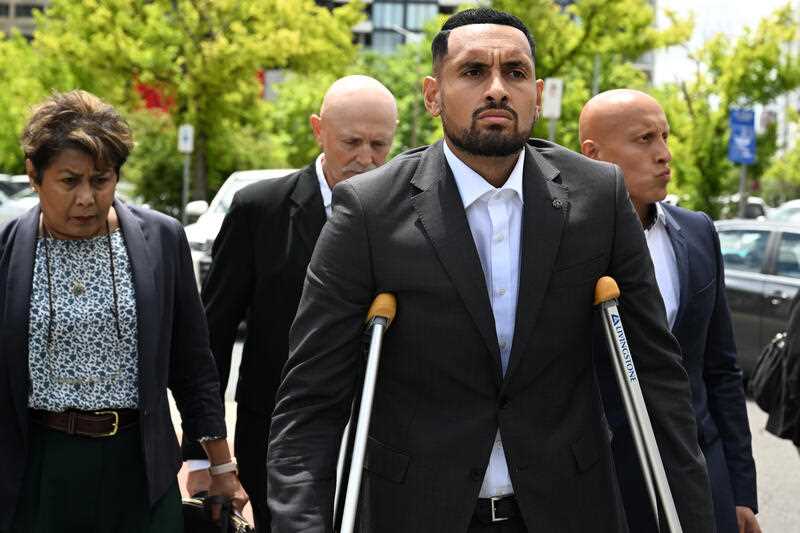 Tennis star Nick Kyrgios using crutches when he arrives at the ACT Magistrates Court in Canberra