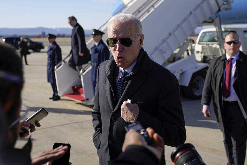 US President Joe Biden speaks with members of the press after stepping off Air Force One