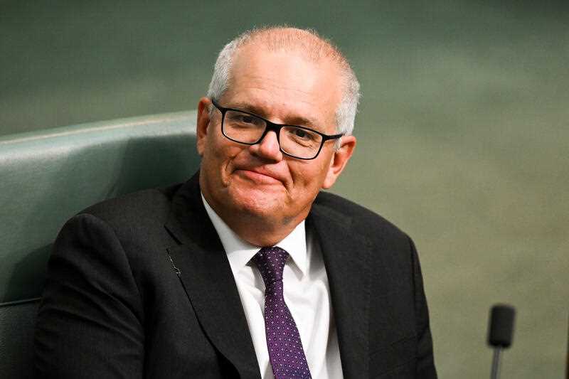 Former Australian Prime Minister Scott Morrison reacts during House of Representatives Question Time at Parliament House in Canberra, Thursday, February 16, 2023.
