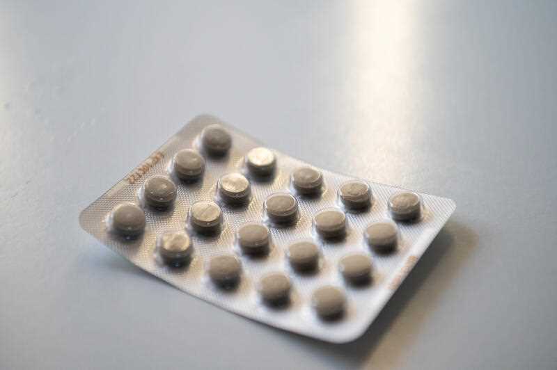 A packet of medicine tablets on a table