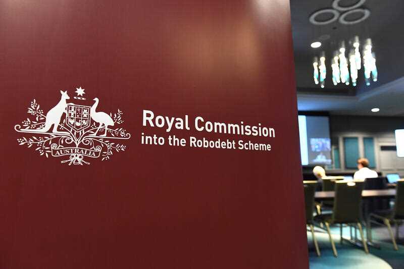 Signage is seen in the media room at the first hearing block of the Royal Commission into the Robodebt Scheme at the Pullman Brisbane King George Square Hotel in Brisbane, Tuesday, December 13, 2022