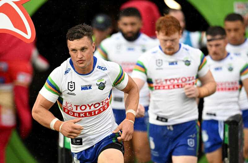 Jack Wighton (left) of the Raiders is seen running onto the field during the NRL Round 2 match between the Dolphins and the Canberra Raiders at Kayo Stadium in Redcliffe, Saturday, March 11, 2023.