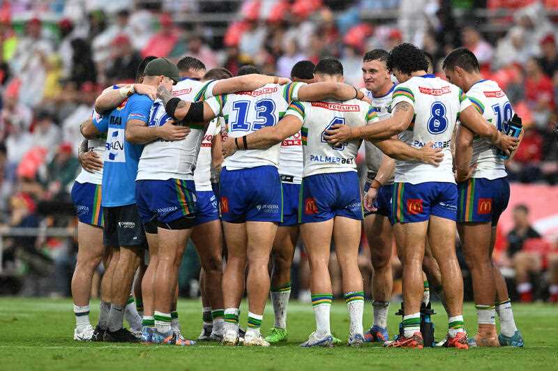 Raiders players are seen in a huddle during the NRL Round 2 match between the Dolphins and the Canberra Raiders at Kayo Stadium in Redcliffe, Saturday, March 11, 2023
