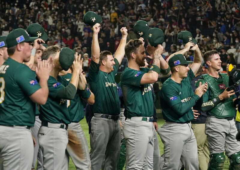 Australia's players and staff celebrate after defeating Czech Republic in Tokyo Pool to advance to the quarterfinal round of the 2023 World Baseball Classic at Tokyo Dome in Tokyo, Japan, 13 March 2023