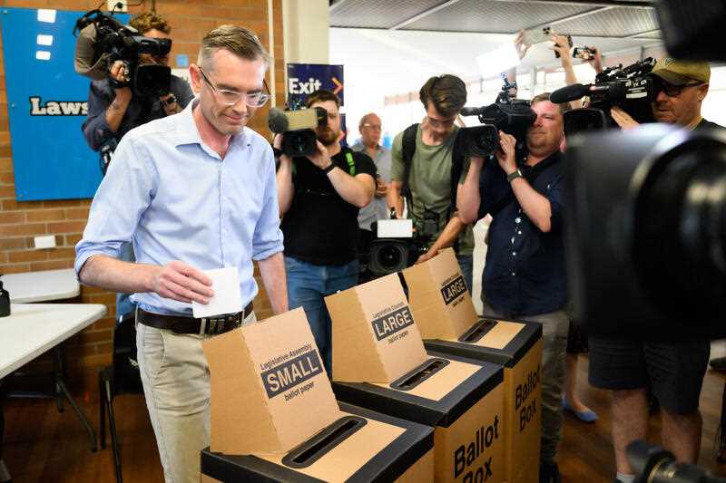 NSW Premier Dominic Perrottet places his vote in the ballot box on NSW state election day, in the seat of Epping, in Sydney, Saturday, March 25, 2023.