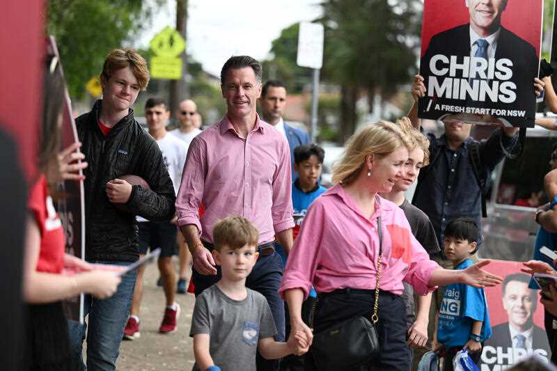 Labor leader Chris Minns arrives with wife Anna and his 3 sons to vote at Carlton South Public School during the NSW state election in Sydney, Saturday, March 25, 2023