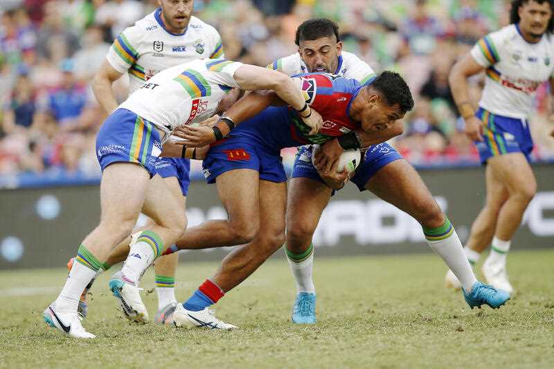 Daniel Saifiti of the Knights is tackled during the NRL Round 4 match between the Newcastle Knights and the Canberra Raiders at McDonald Jones Stadium in Newcastle, Sunday, March 26, 2023