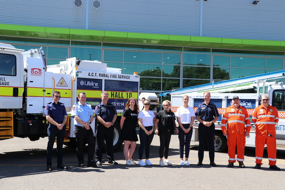 Lifeline and ACTESA personnel with the branded vehicles. Photo: Nicholas Fuller