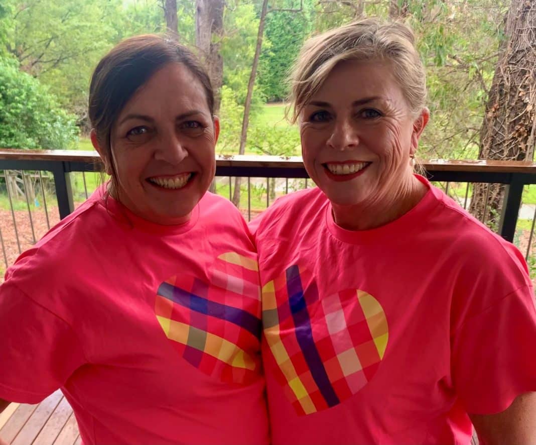 2 women in matching pink Mother's Day Classic T-shirts