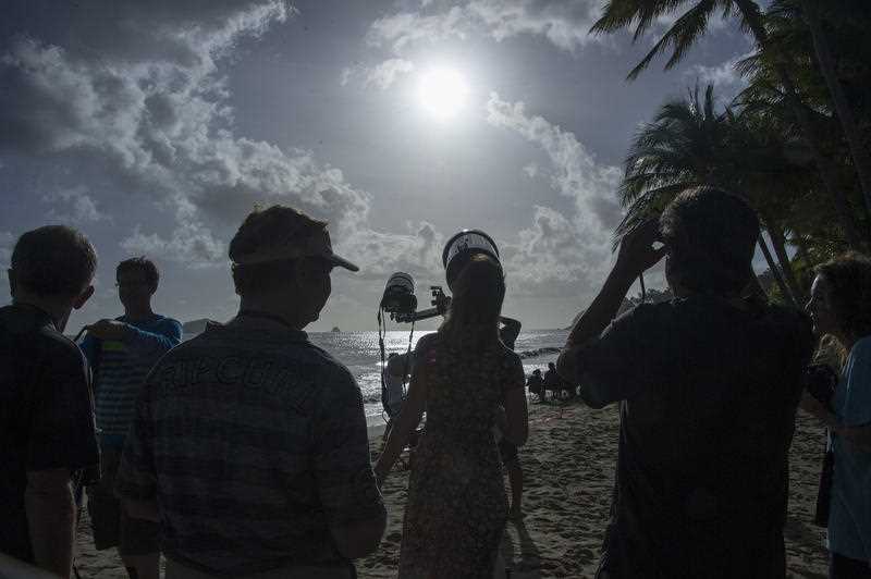 Scientists observe and record the solar eclipse to beam back live to NASA in the US from Ellis Beach north of Cairns in far north Queensland, Wednesday, Nov. 14, 2012.