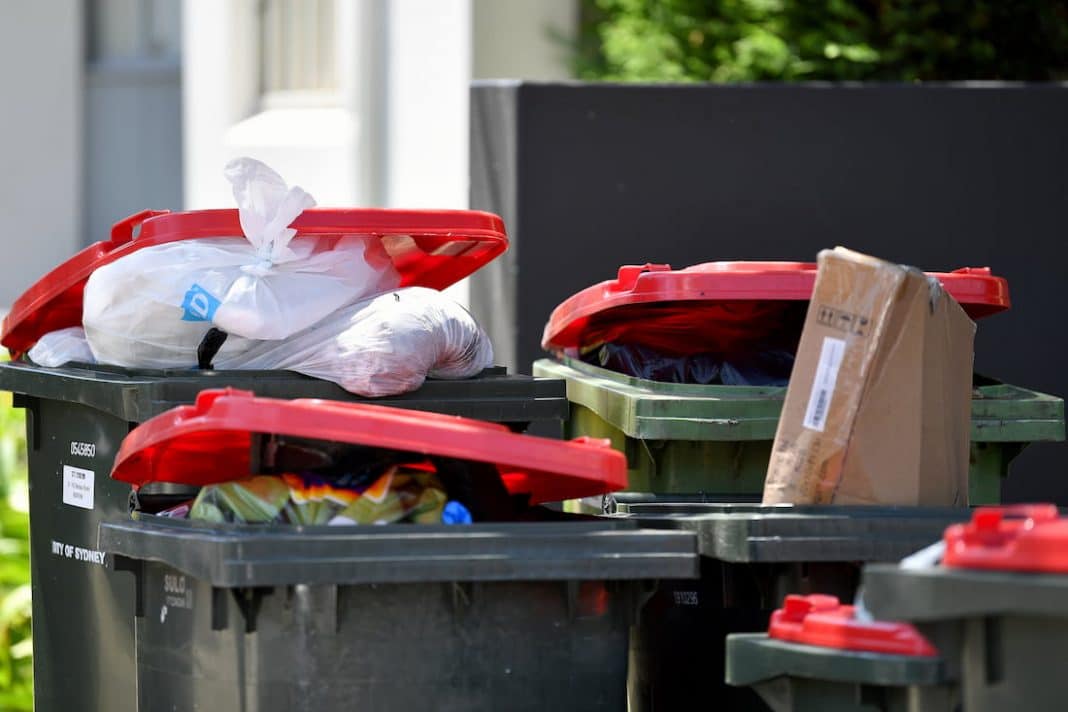 Bins uncollected as garbos strike in Sydney, Canberra