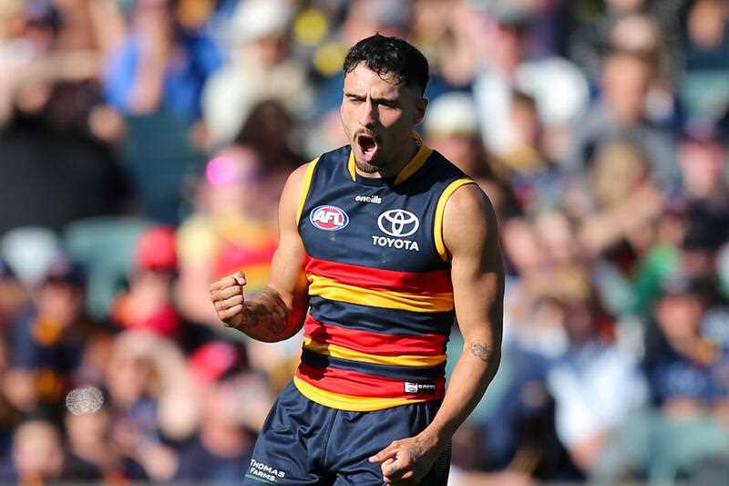 Izak Rankine of the Crows celebrates a goal during an AFL match