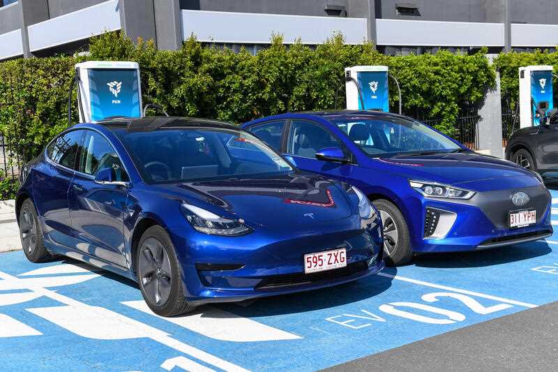 Electric cars and charging stations are seen at Tritium, Brisbane