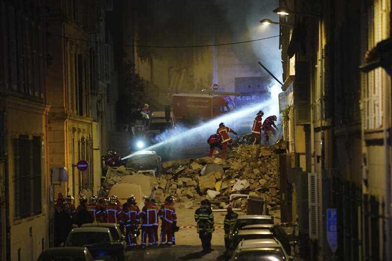 Firefighters work after building collapsed early Sunday, April 9, 2023 in Marseille, southern France