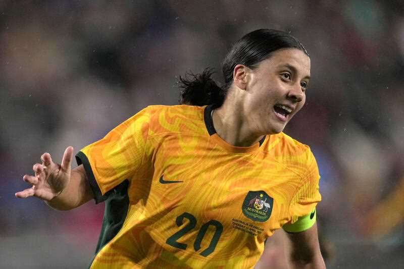 Australia's Sam Kerr celebrates after scoring against England during the women's international friendly soccer match between England and Australia at the Gtech Community Stadium in London, England, Tuesday, April 11, 2023
